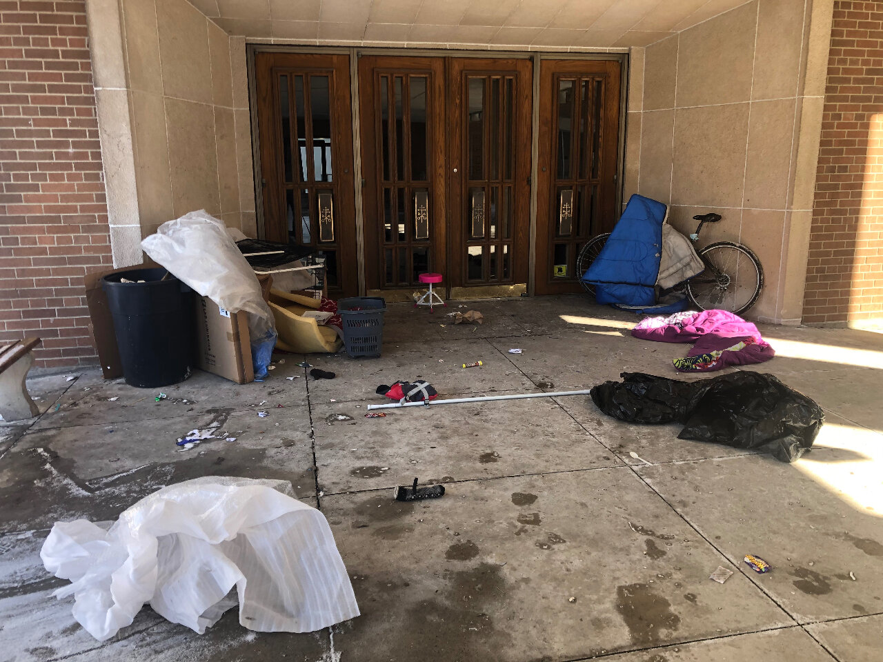 Piles of debris in front of church doors